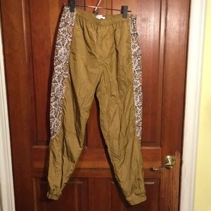 Gold joggers with floral side pattern